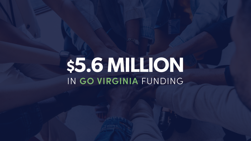 manos unidas en círculo con texto blanco superpuesto que dice: “$5.6 millones en financiamiento de GO Virginia”.